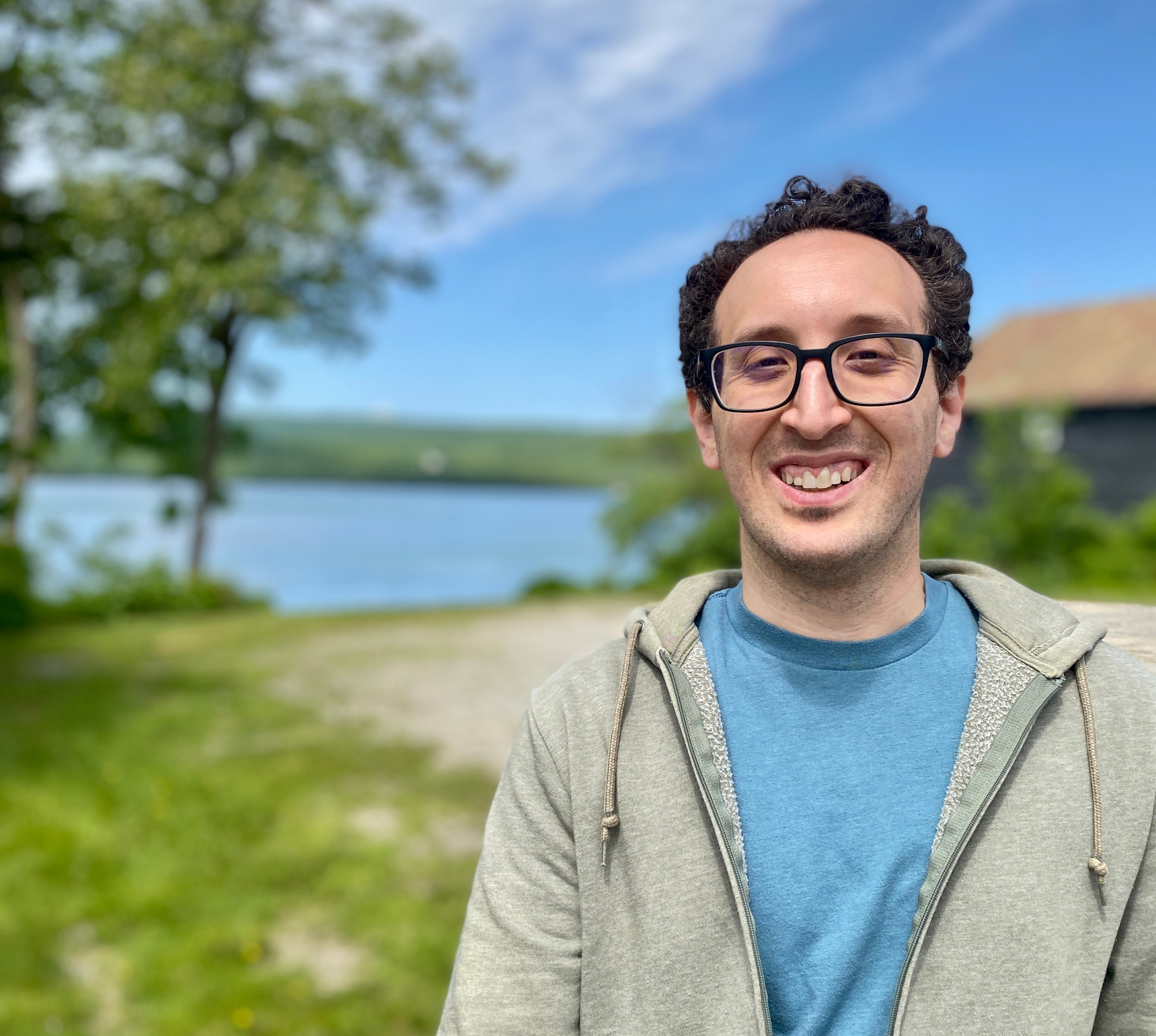 Story Trails of Maine founder at lake in Maine