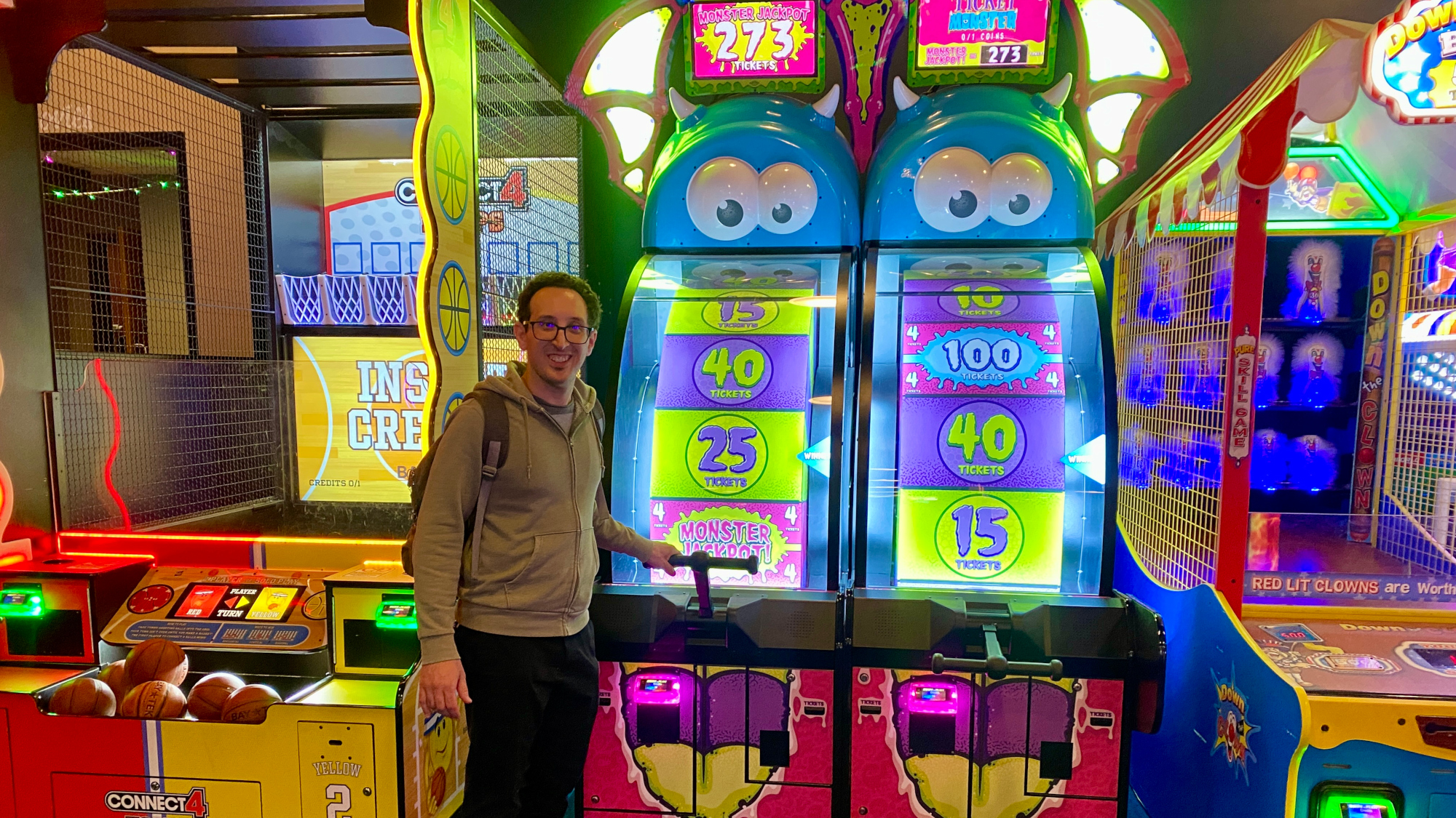 Person playing arcade game machine.